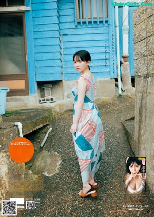 A magazine with a picture of a woman in a white bra.