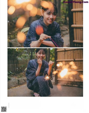 A woman in a blue kimono holding an umbrella.