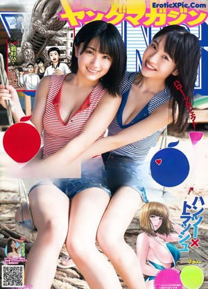 Two young women in bikinis posing for a picture. 