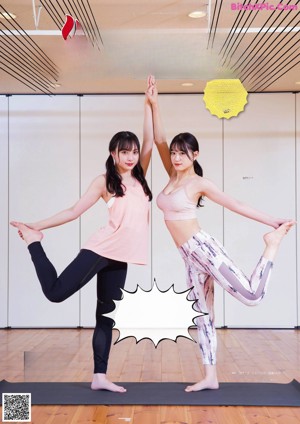 A woman in a pink top and leggings doing yoga.